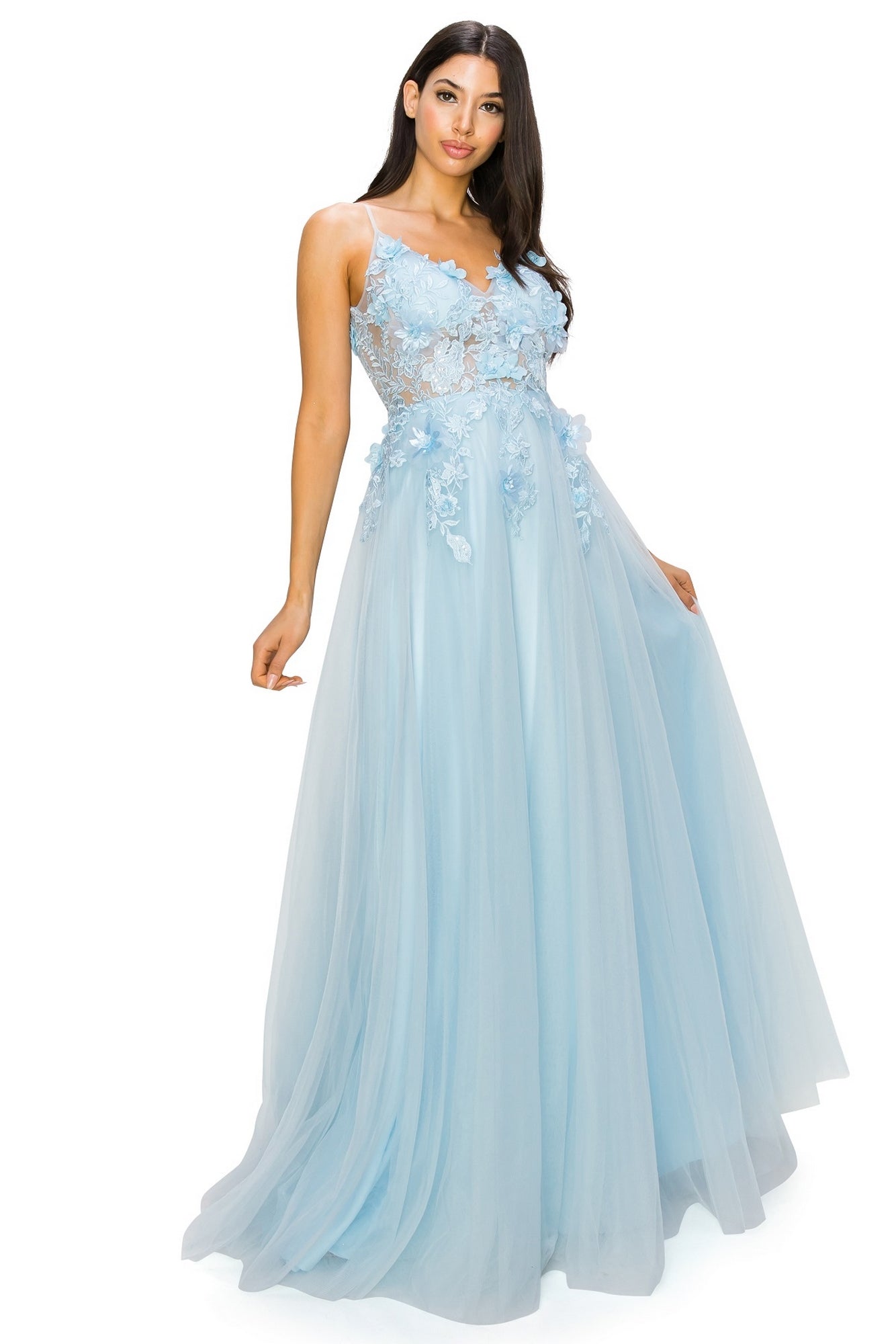A woman poses against a white background wearing the Sheer-Bodice Long A-Line Prom Ball Gown 8038J, featuring a floor-length light blue skirt, a sheer bodice, and intricate 3-D floral designs.